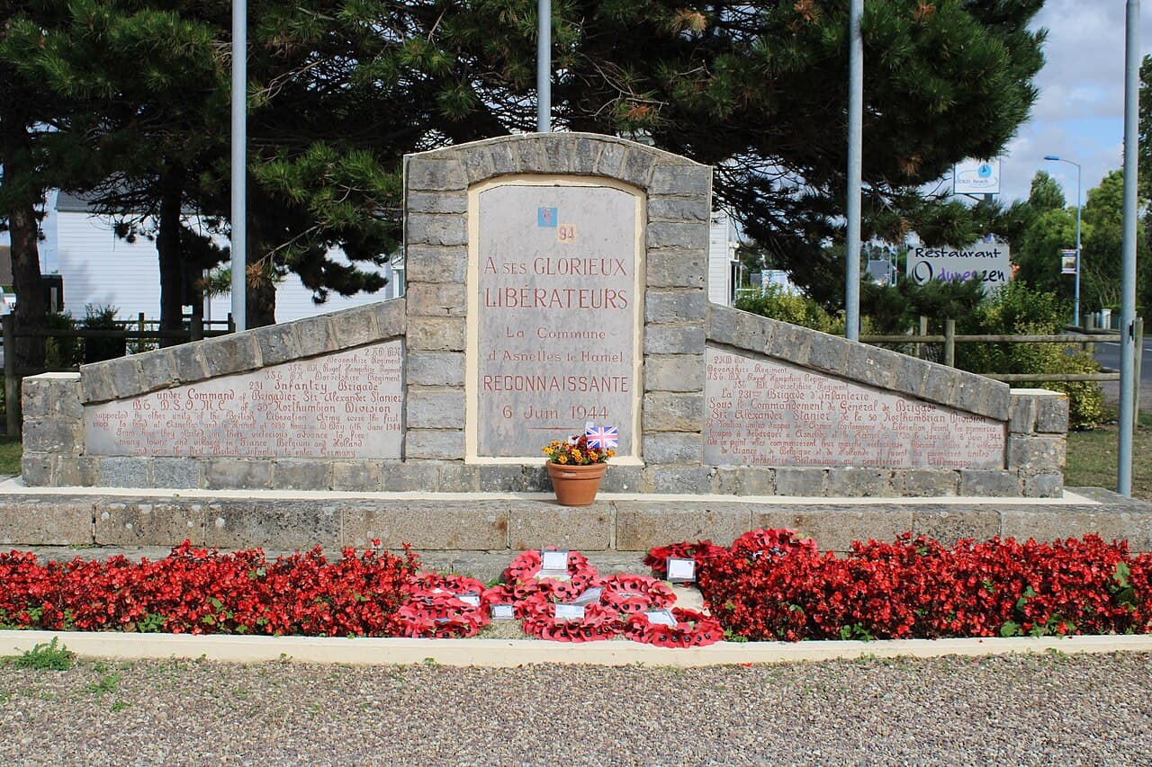 The D-Day memorial at Asnelles-le-Hamel on Gold Beach, with poppy wreaths at its foot