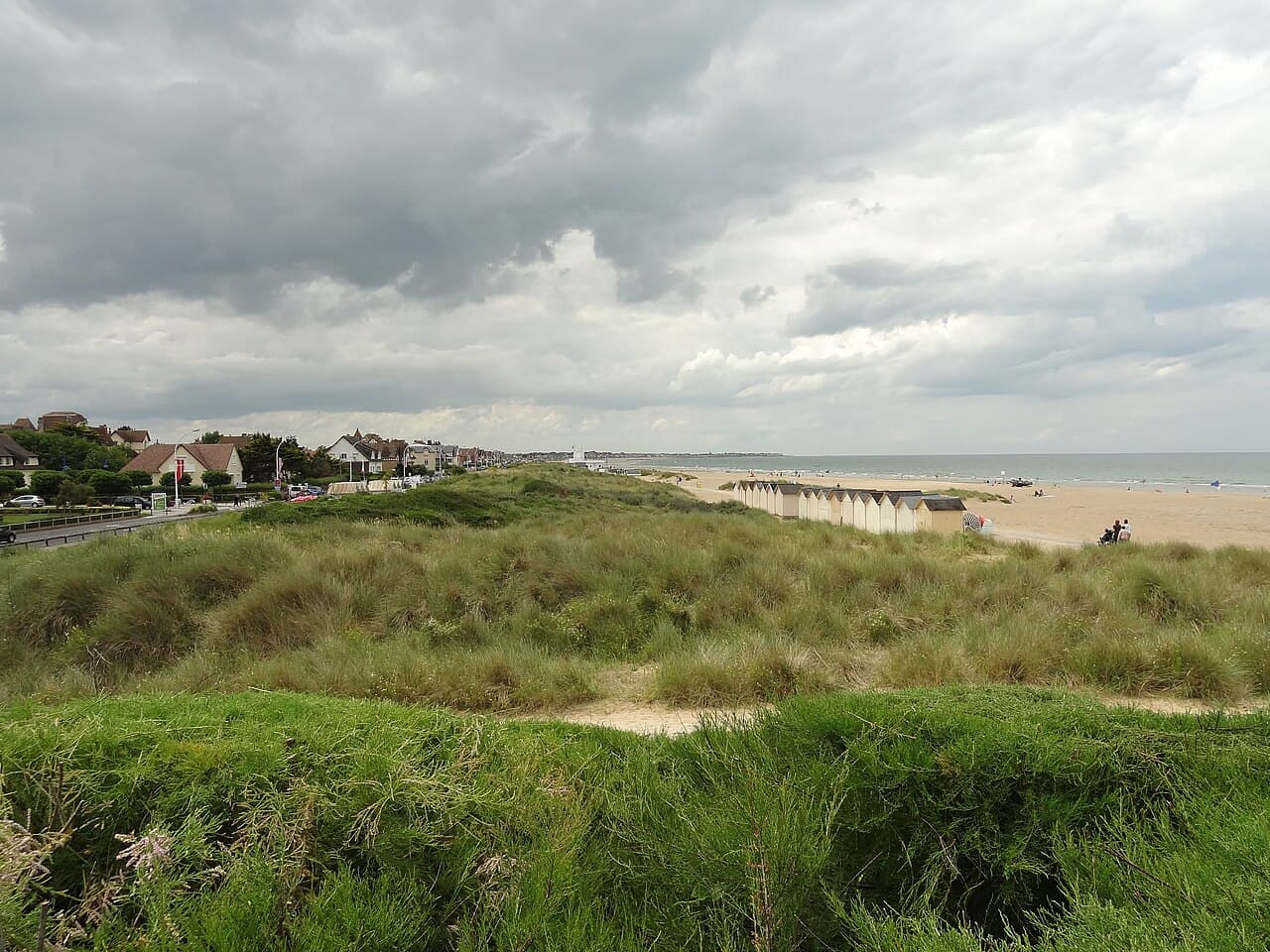 Sword Beach today at Ouistreham, with its row of beach huts along the dunes