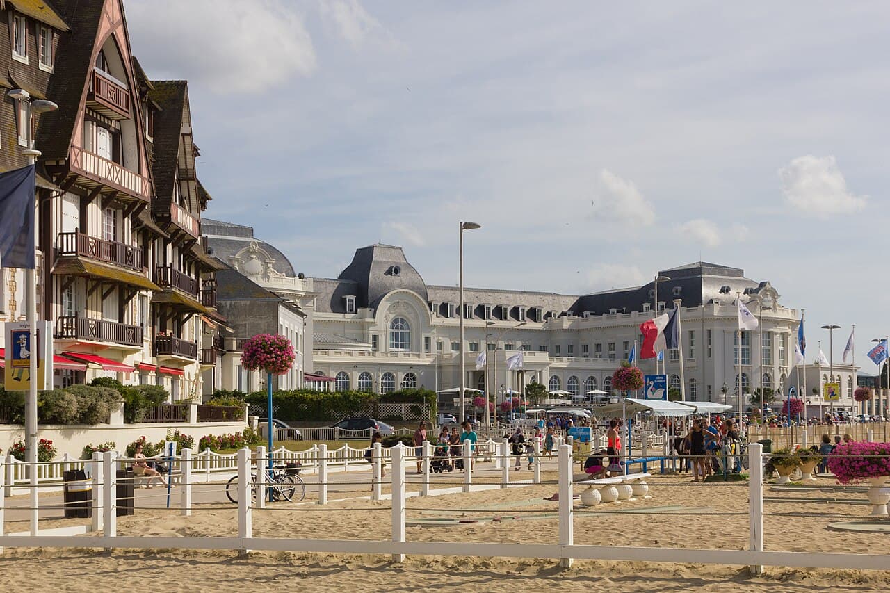 The seafront of Trouville-sur-Mer, with its half-timbered villas and the Cures Marines palace behind the beach