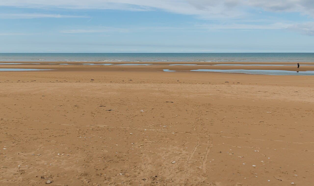 Omaha Beach on a quiet day, looking out over the Normandy coastline
